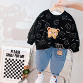 بلوز مشکی طرحدار دورس تدی و شلوار جین